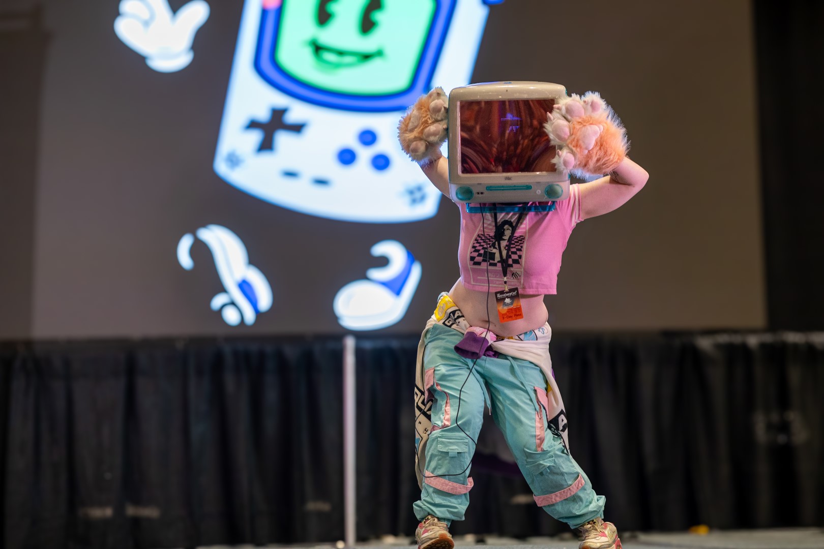 Creator performing on stage at a Click Stream community event